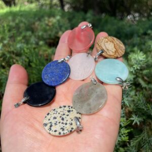 Flat round crystal pendant