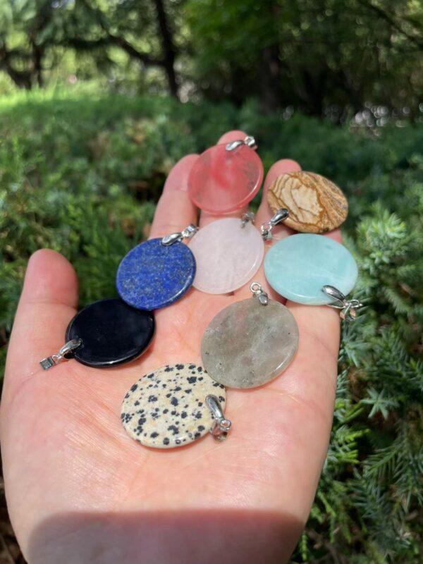 Flat round crystal pendant